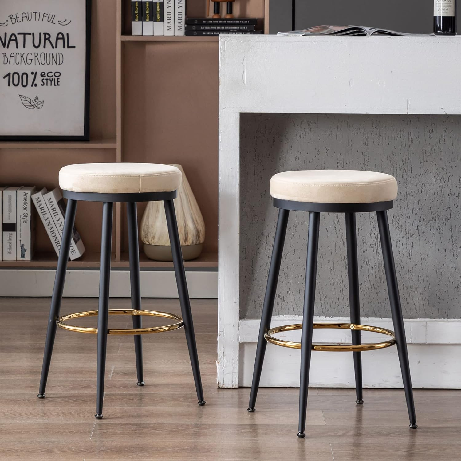 Set of 2 modern suede counter stools with black legs and gold footrest, perfect for kitchen